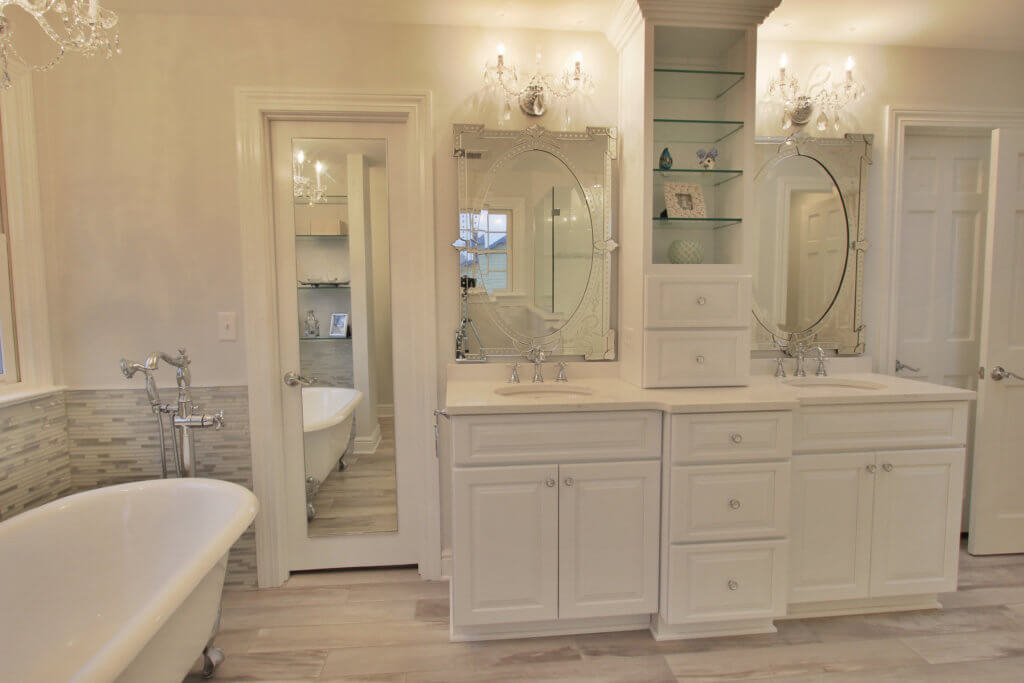 This bathroom remodel features a clawfoot tub and gorgeous cabinetry.